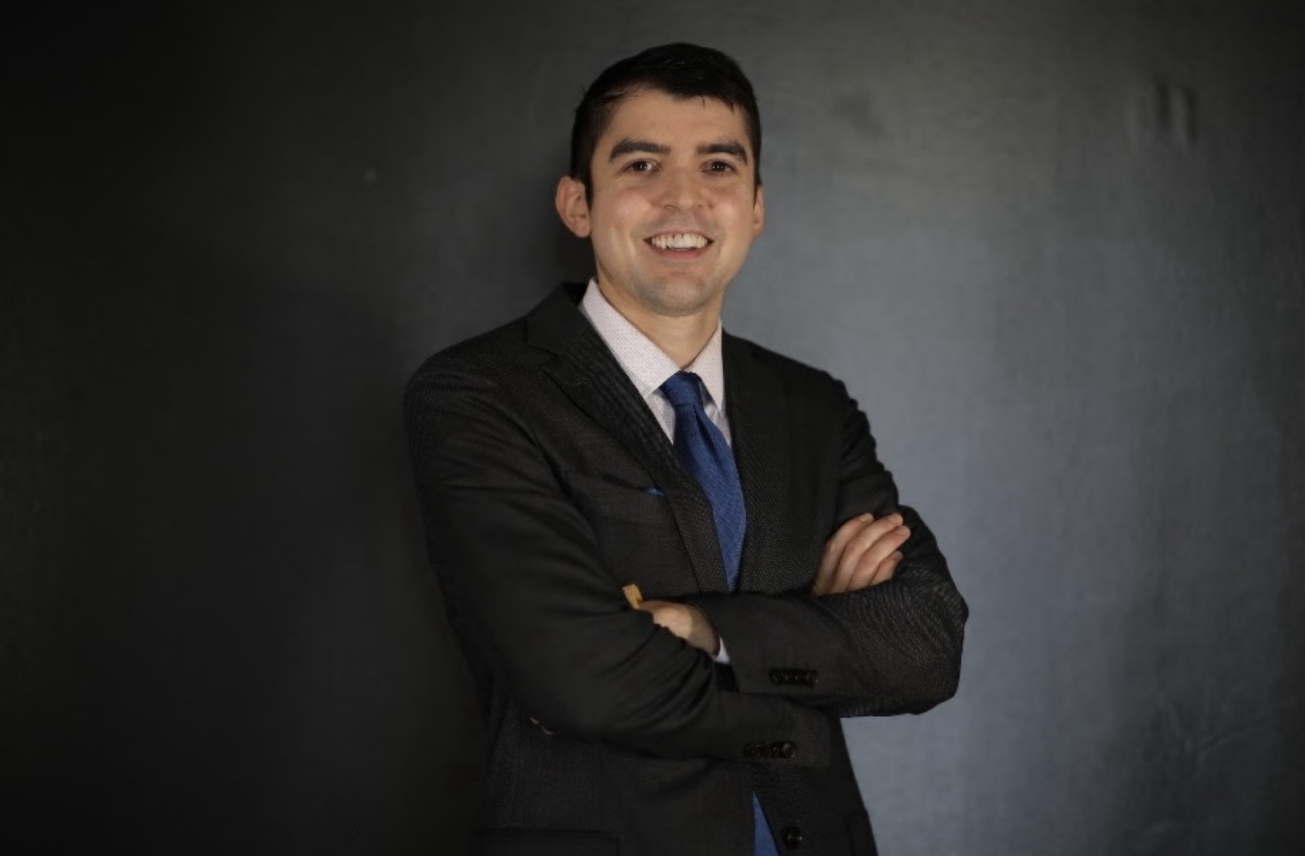 Samuel Castillo - Professional headshot in business suit